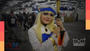 Ilustração do Anime Friends 2026 com destaque para entrada gratuita no primeiro dia e doação de 1 kg de alimento