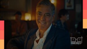 George Clooney ao lado de cenário do Festival de Veneza, com referência ao Leão de Ouro