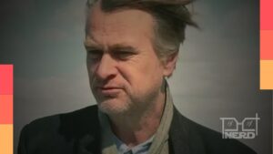 Christopher Nolan em imagem promocional, associado ao debate de jovens rejeitando conteúdo de IA