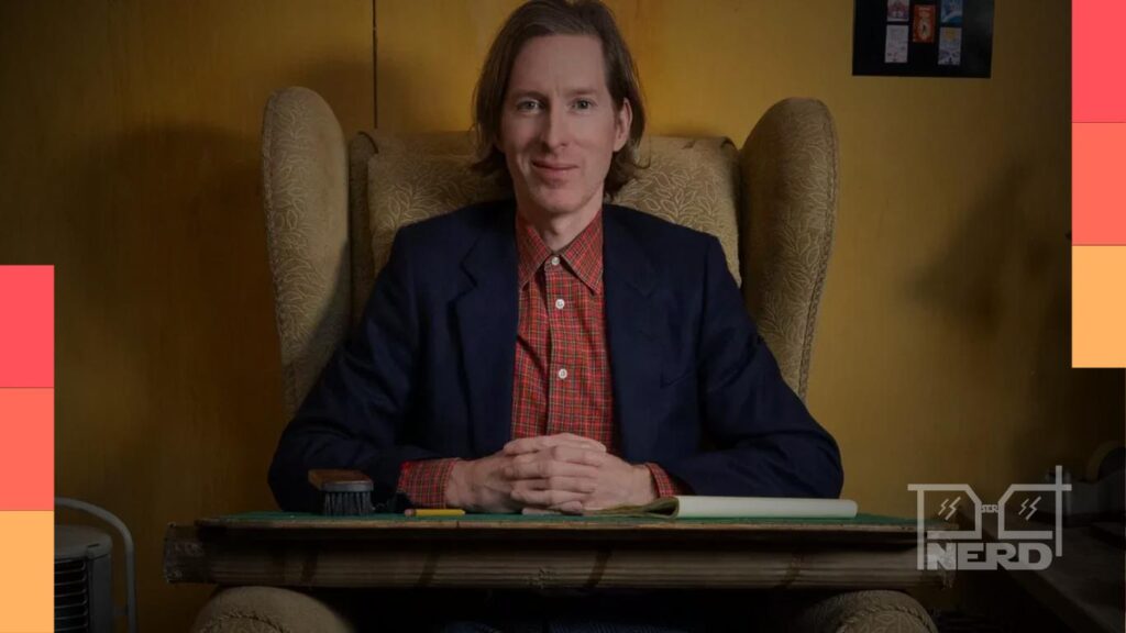 Wes Anderson em evento, com tema de faroeste sugerindo western estiloso