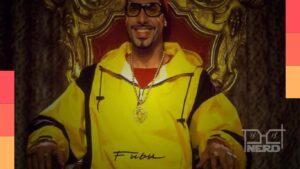 Pôster oficial do filme Who Iz I, com o personagem Ali G, anunciando que o trailer será divulgado amanhã