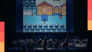 Orquestra tocando músicas de Undertale no telão, com anúncio da turnê no Brasil