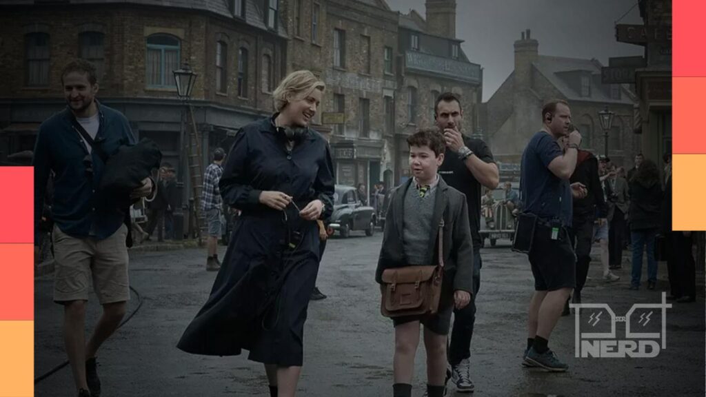 Greta Gerwig aparece dirigindo David McKenna no set de Nárnia: O Sobrinho do Mago, em cenário de Londres dos anos 1950.